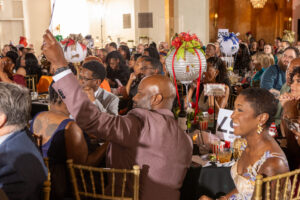 Attendees bidding on Fund a Need